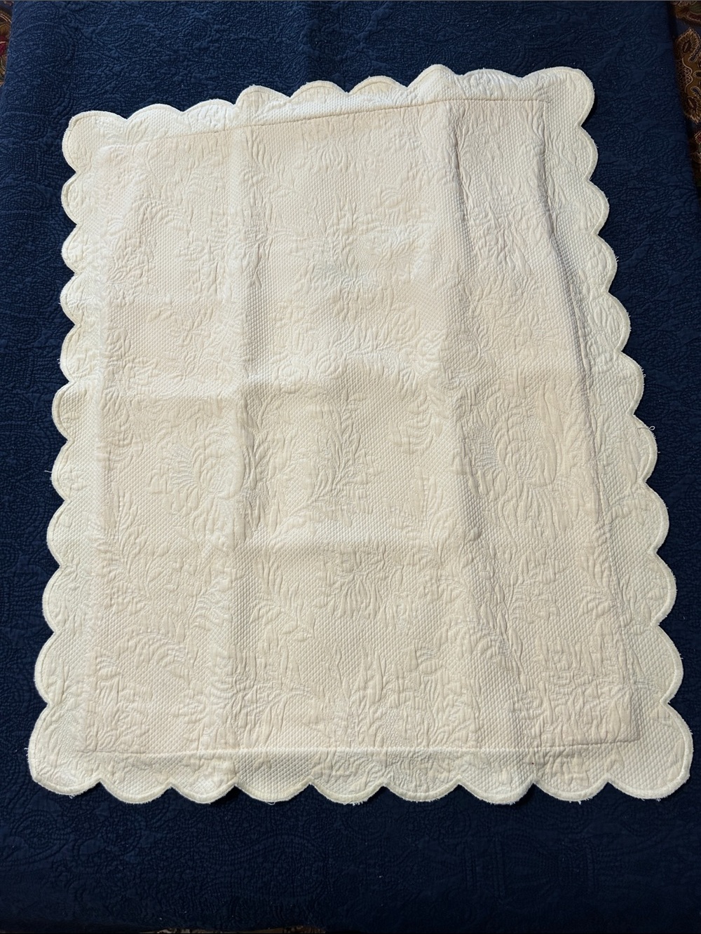 Pale yellow quilted standard size pillow shams with quilted edges.